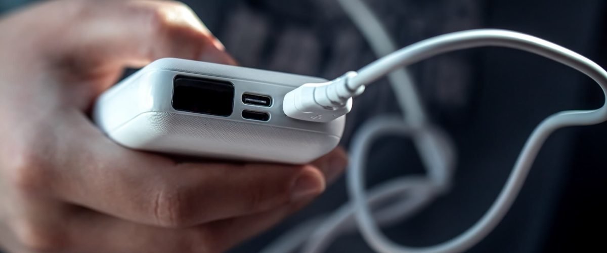 close-up-of-a-white-power-bank-in-a-female-hand-2021-10-19-16-55-26-utc